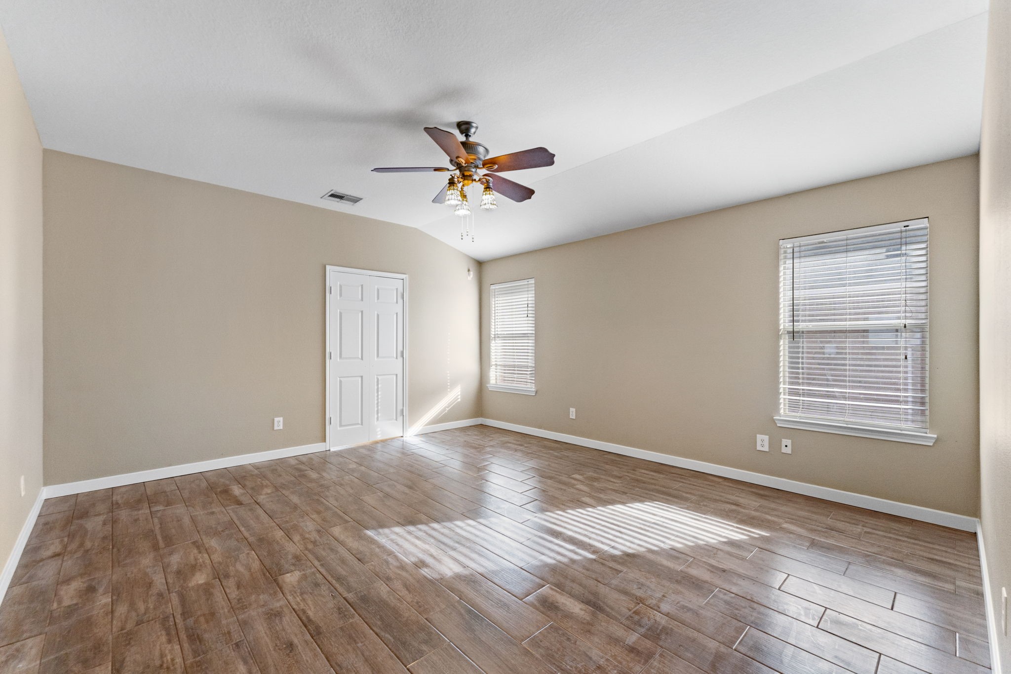 21146 Terrace Vine Lane Spring, TX 77379 - Photo 16 of 38 Primary bedroom with tile floor and plenty of natural light.