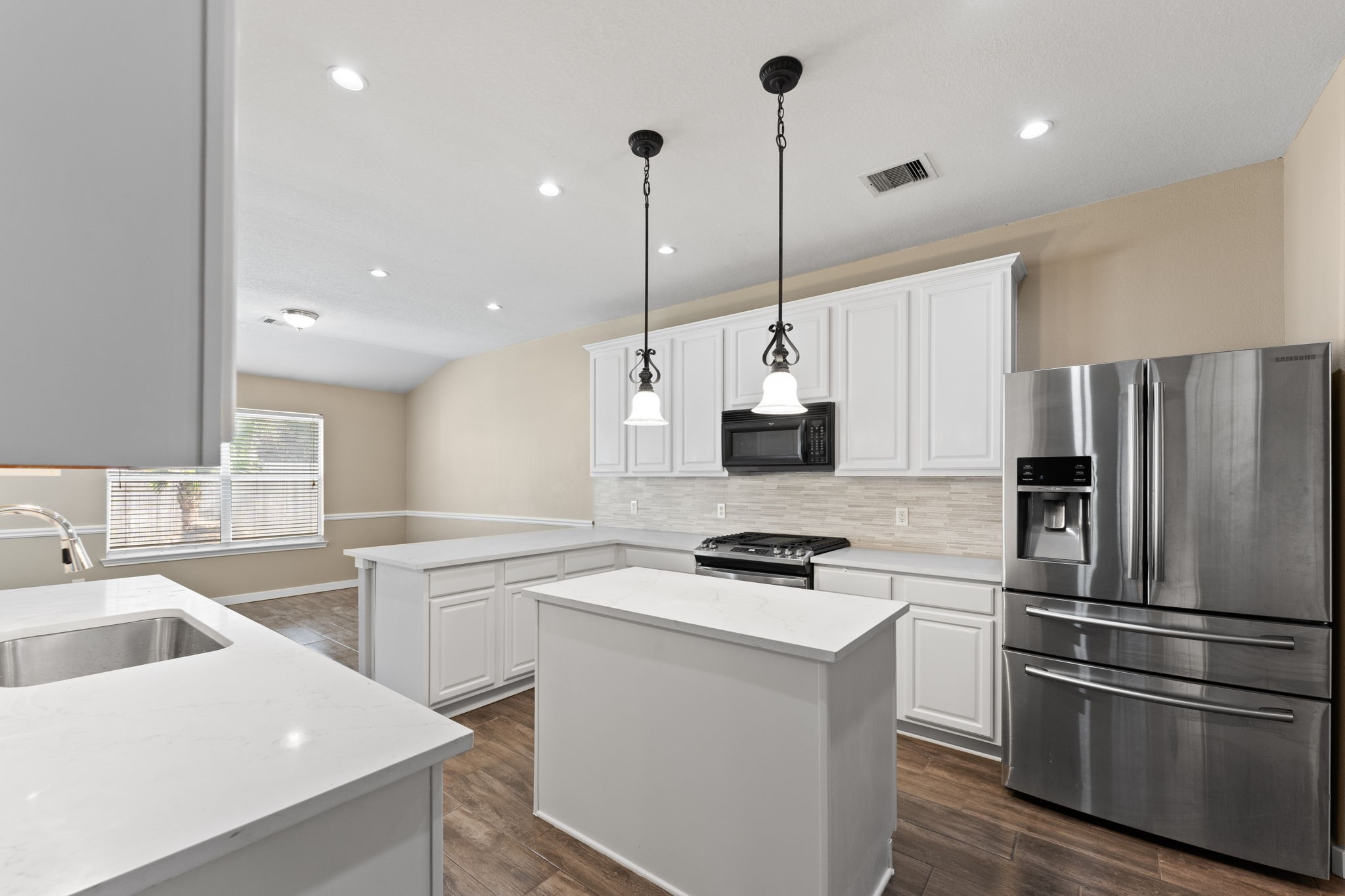 21146 Terrace Vine Lane Spring, TX 77379 - Photo 26 of 38 Quartz countertops, stainless steel appliances, stacked tile backsplash