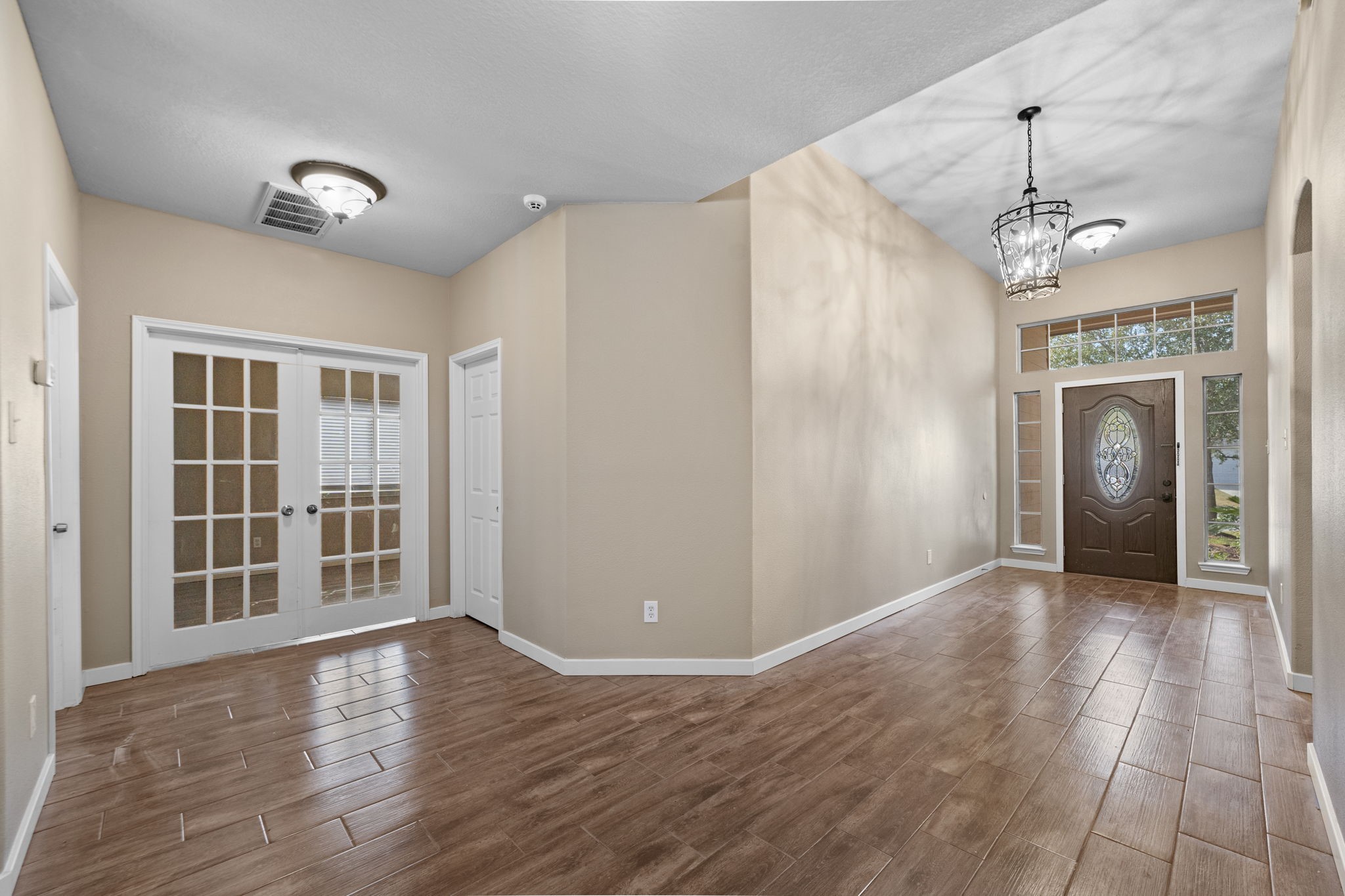 21146 Terrace Vine Lane Spring, TX 77379 - Photo 9 of 38 Wide open foyer that leads to the office/study with french doors. To the right is the laundry room and garage entrance. To the left is the primary bedroom.