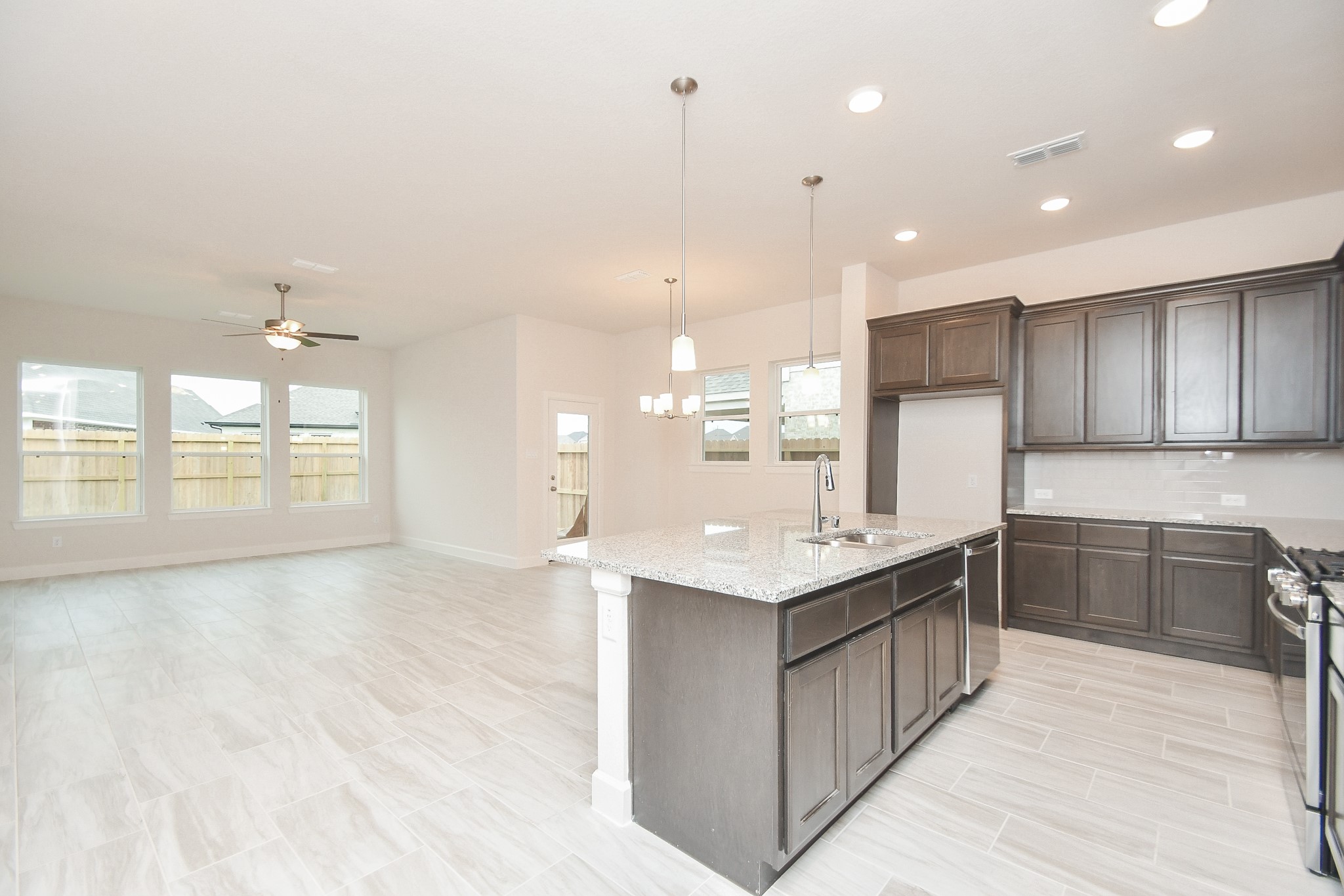 146 Amaranth Way Richmond, TX 77406 - Photo 18 of 18 a large kitchen with kitchen island a sink stainless steel appliances and cabinets