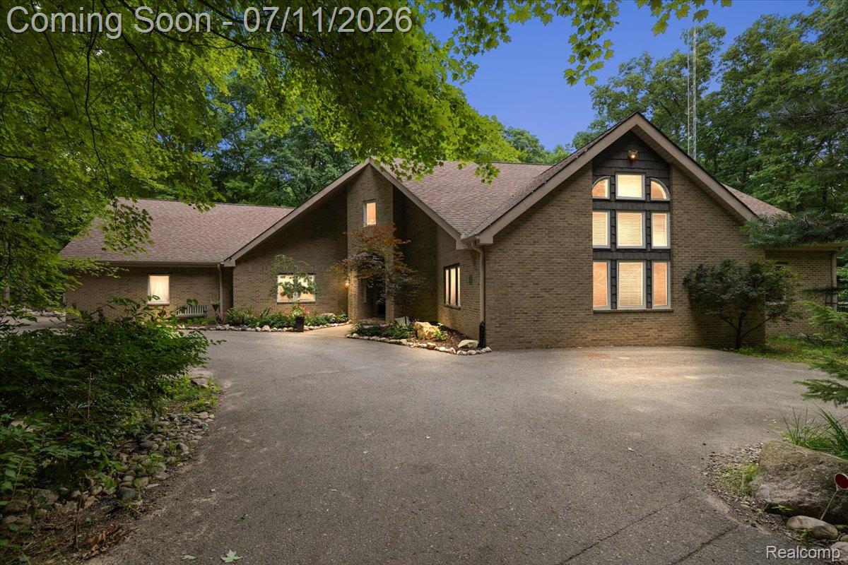4219 Gardner Road Metamora, MI 48455 - Photo 1 of 87 Brick facade residence with a multi-pane arched window feature, a gabled roofline, and a paved driveway