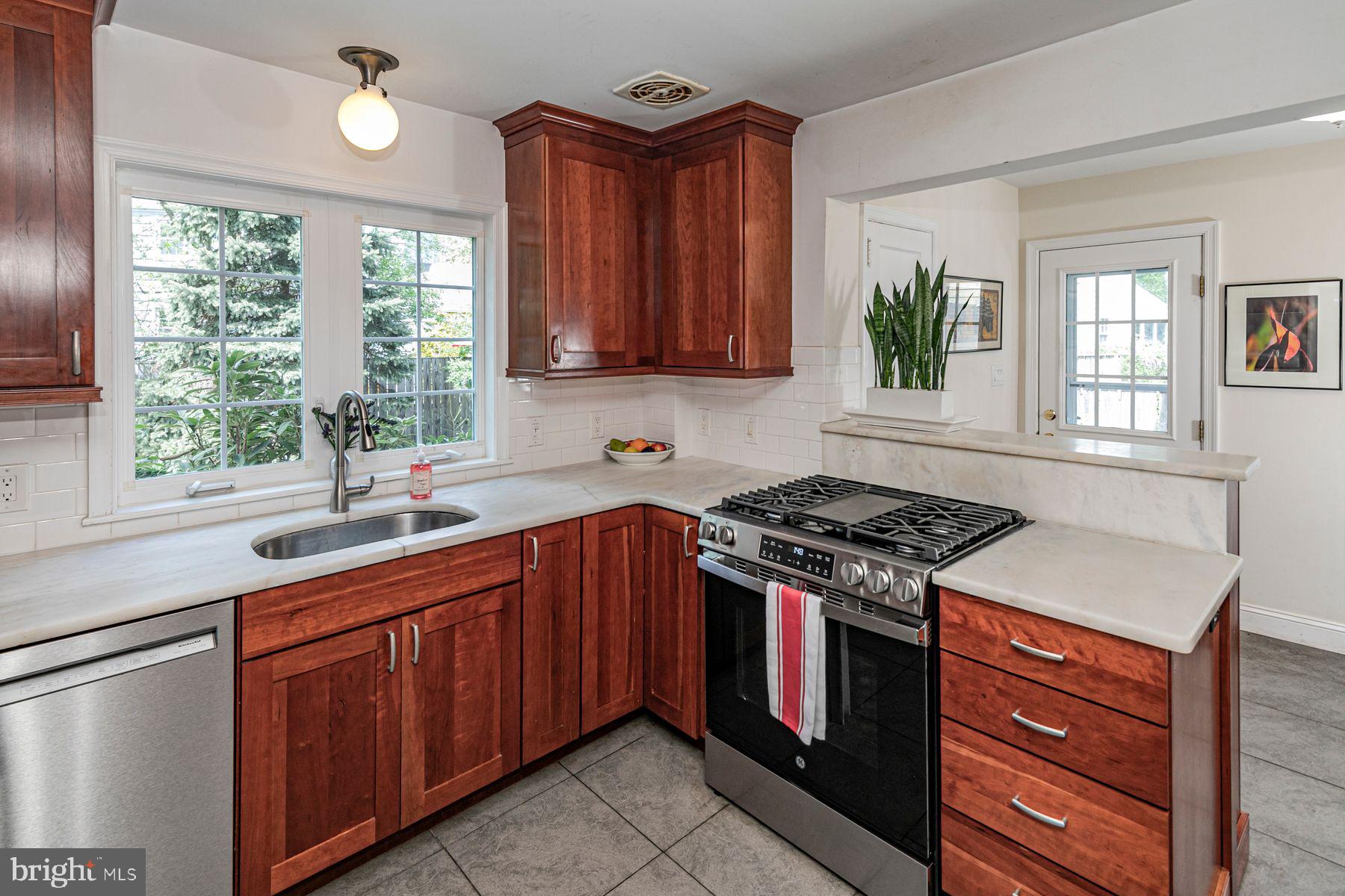 44 Southern Way Princeton, NJ 08540 - Photo 12 of 35 a kitchen with a stove sink and cabinets