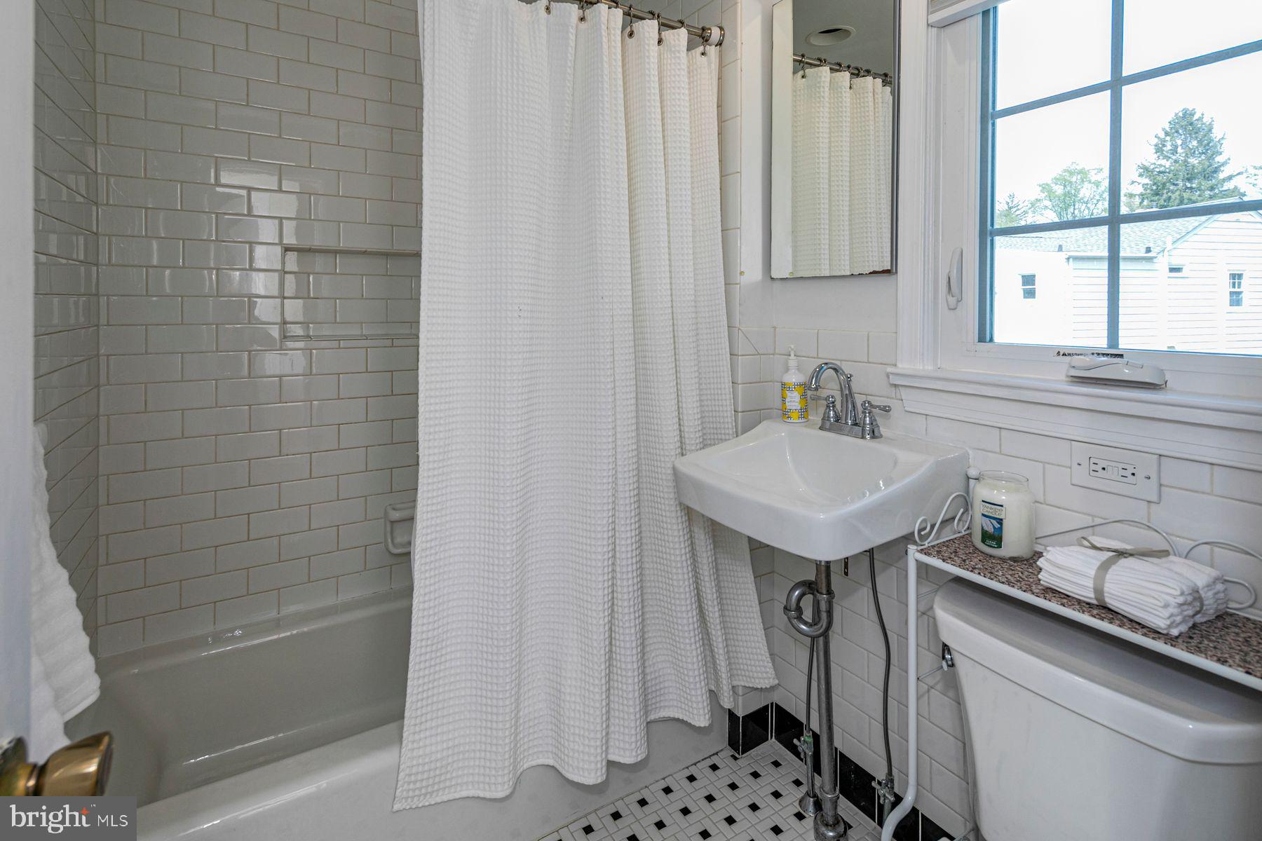 44 Southern Way Princeton, NJ 08540 - Photo 24 of 35 a bathroom with a sink a toilet and shower