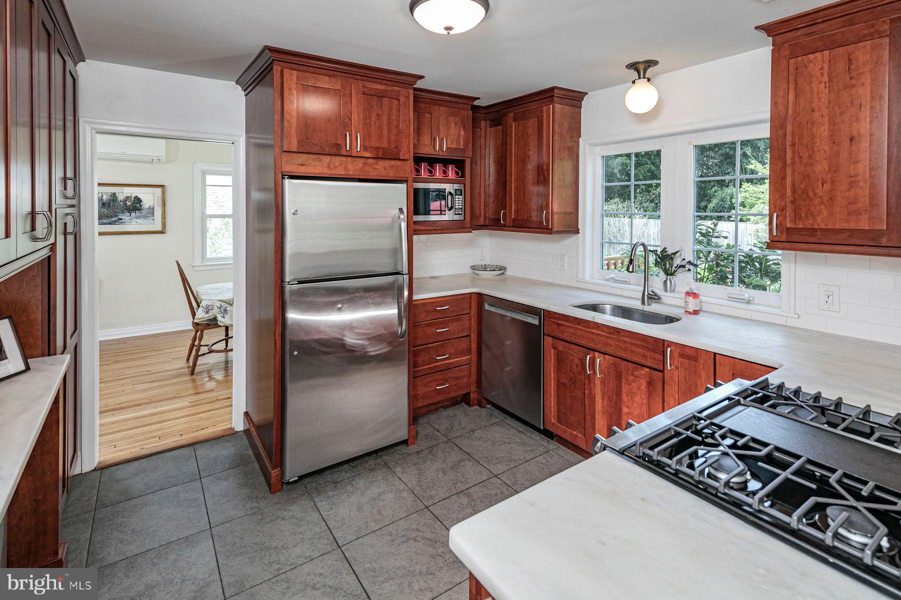 44 Southern Way Princeton, NJ 08540 - Photo 9 of 35 a kitchen with stainless steel appliances granite countertop a refrigerator stove and sink