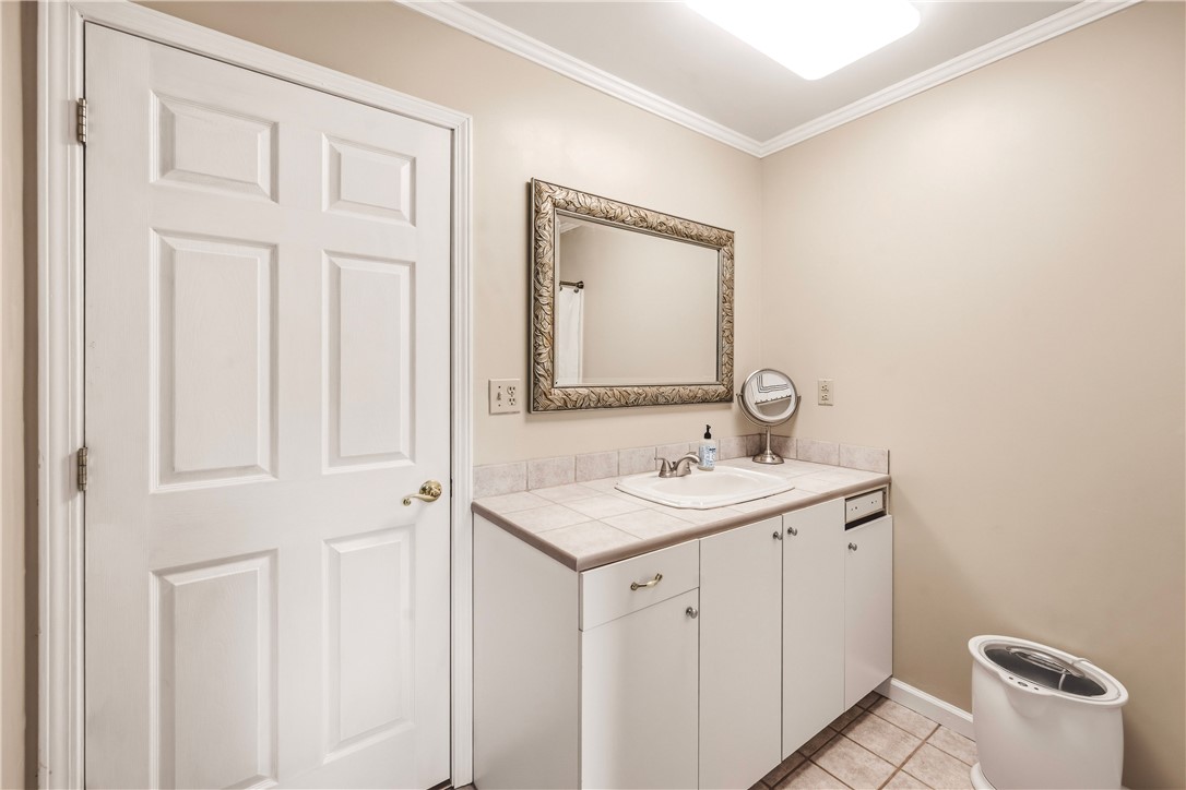 2001 Ridgeview Lane Seneca, SC 29678 - Photo 24 of 27 A compact vanity with tile counters offers functional elegance in this well-appointed bathroom.