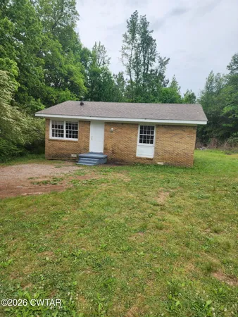 a front view of a house with yard