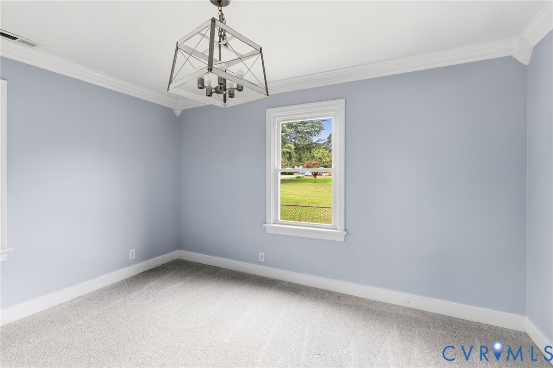 5901 Bonneau Road Richmond, VA 23227 - Photo 6 of 21 Fitted carpet, crown molding, white trim, and a ch