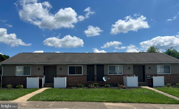 511 Wise Avenue, Unit B Red Lion, PA 17356 - Photo 1 of 1 a view of a house with a yard and a large tree