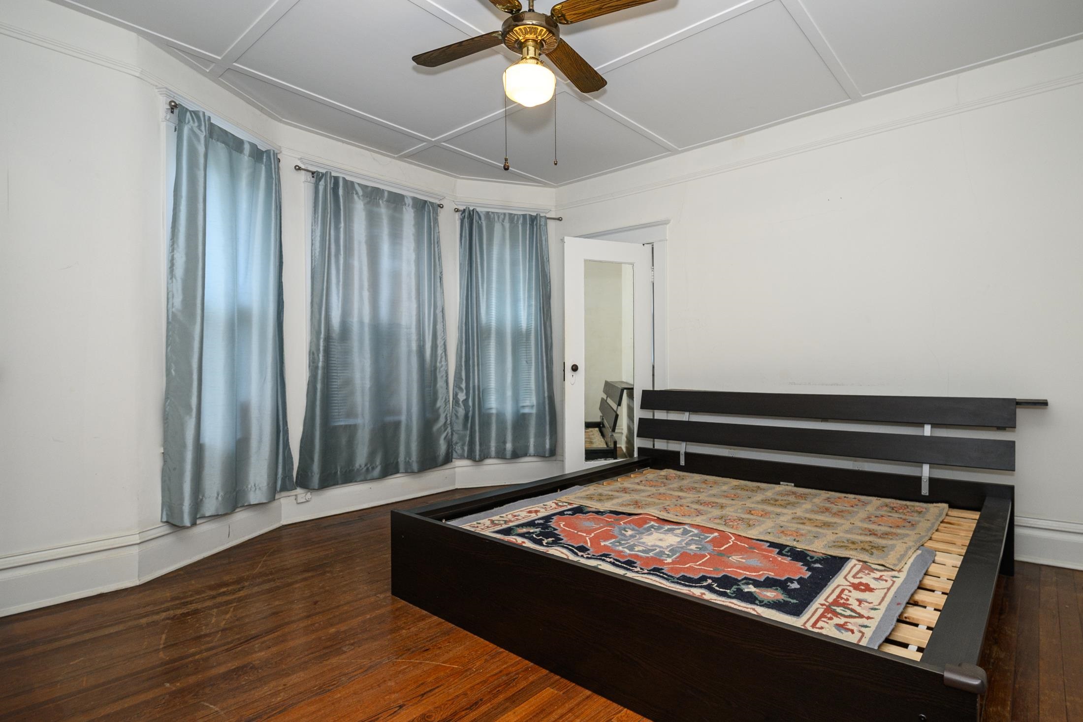 24 Saragossa Street St. Augustine, FL 32084 - Photo 68 of 99 a view of a room with wooden floor and ceiling fan