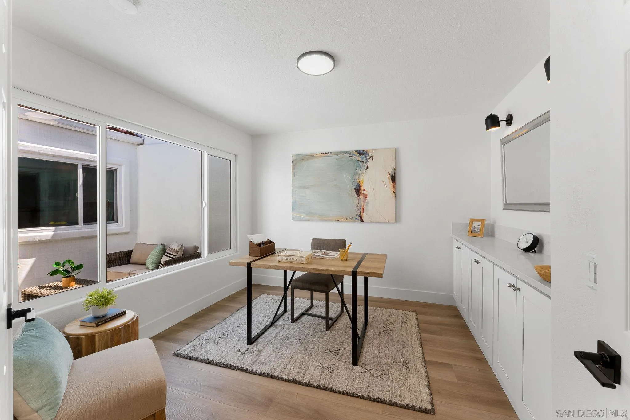 4714 Athos Way Oceanside, CA 92056 - Photo 13 of 34 a living room with furniture rug and a window