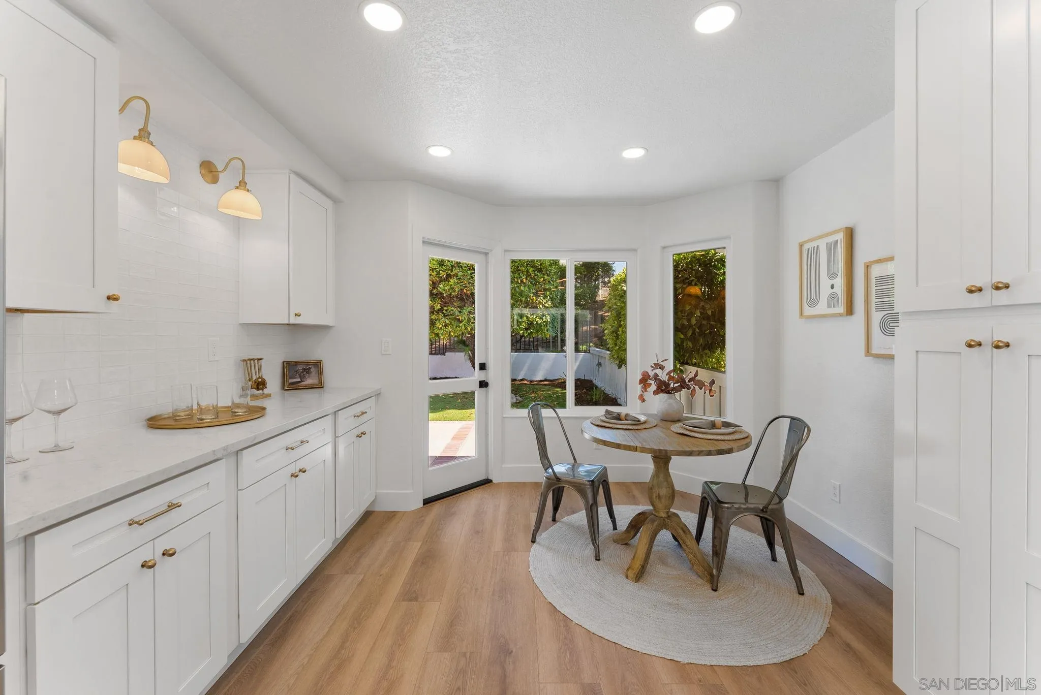 4714 Athos Way Oceanside, CA 92056 - Photo 18 of 34 a view of a dining room with furniture and wooden floor
