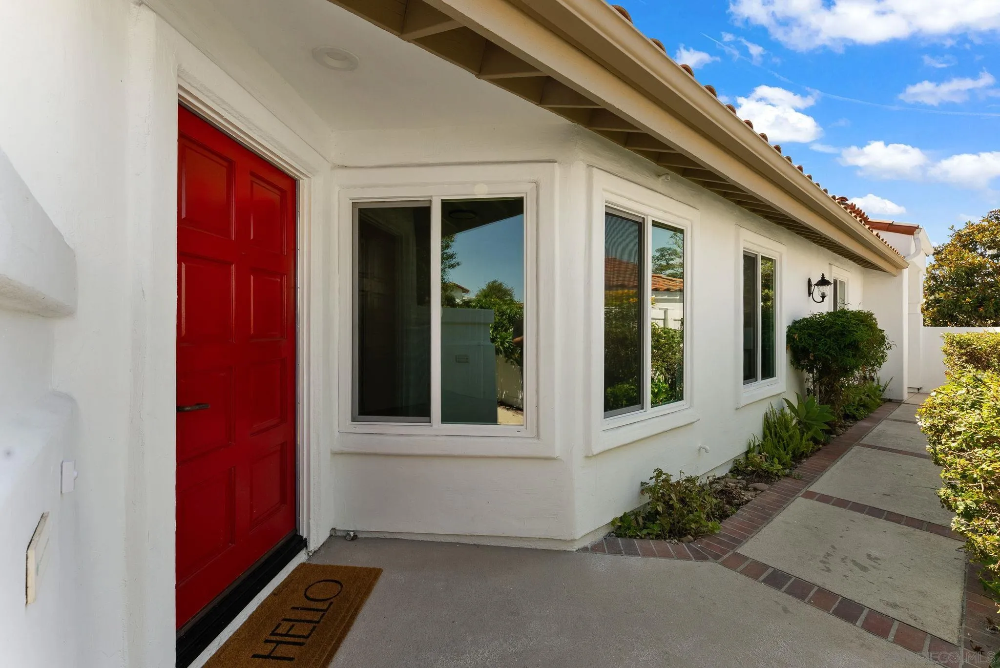 4714 Athos Way Oceanside, CA 92056 - Photo 26 of 34 a house with a potted plant in front of it