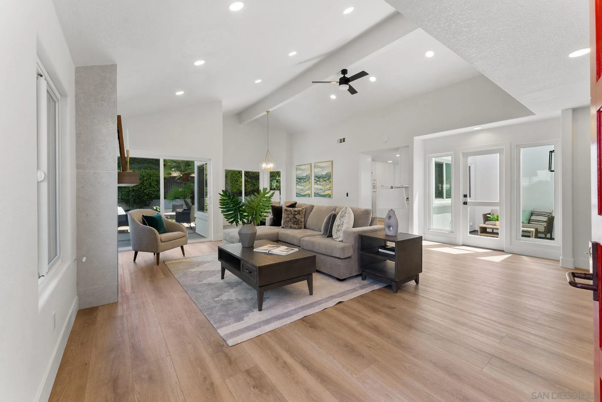 4714 Athos Way Oceanside, CA 92056 - Photo 4 of 34 a living room with furniture or wooden floor and a large window