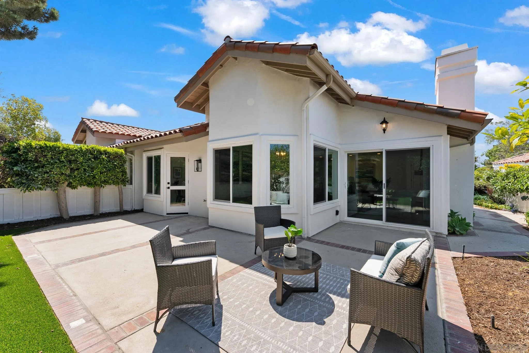4714 Athos Way Oceanside, CA 92056 - Photo 7 of 34 a view of a house with backyard and sitting area