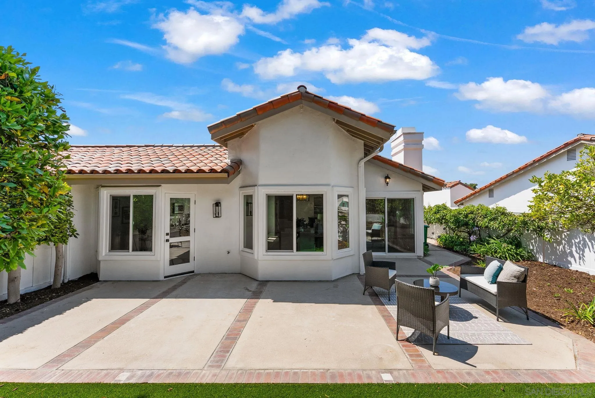 4714 Athos Way Oceanside, CA 92056 - Photo 8 of 34 a view of a house with backyard sitting area and garden