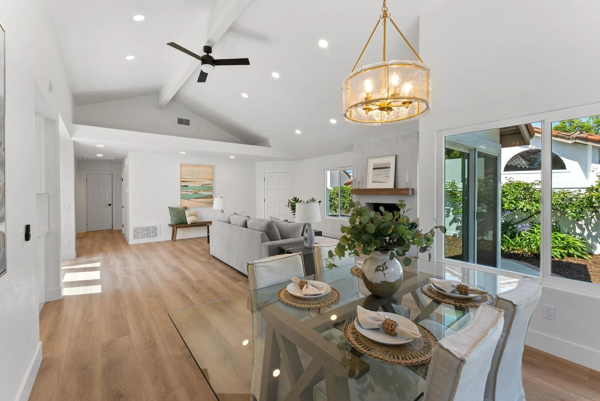 4714 Athos Way Oceanside, CA 92056 - Photo 10 of 34 a view of a dining room with furniture wooden floor and chandelier