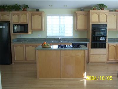 48 Yosemite Road, Unit 48 San Rafael, CA 94903 - Photo 4 of 8 a kitchen with stainless steel appliances granite countertop a refrigerator a stove top oven a sink and dishwasher