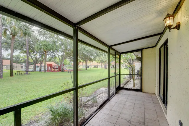 an aerial view of a house with a yard table and chairs