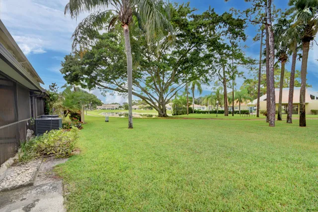 an aerial view of house with yard swimming pool and outdoor seating