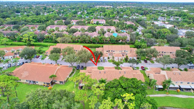 a view of house with swimming pool and a garden
