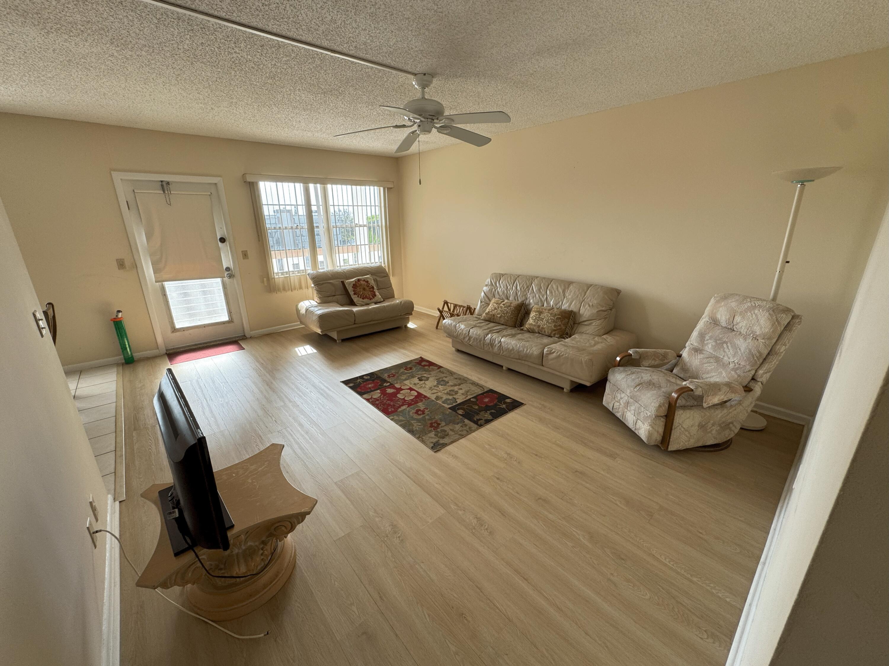 4075 Cornwall East Boca Raton, FL 33434 - Photo 4 of 30 a living room with furniture and a window