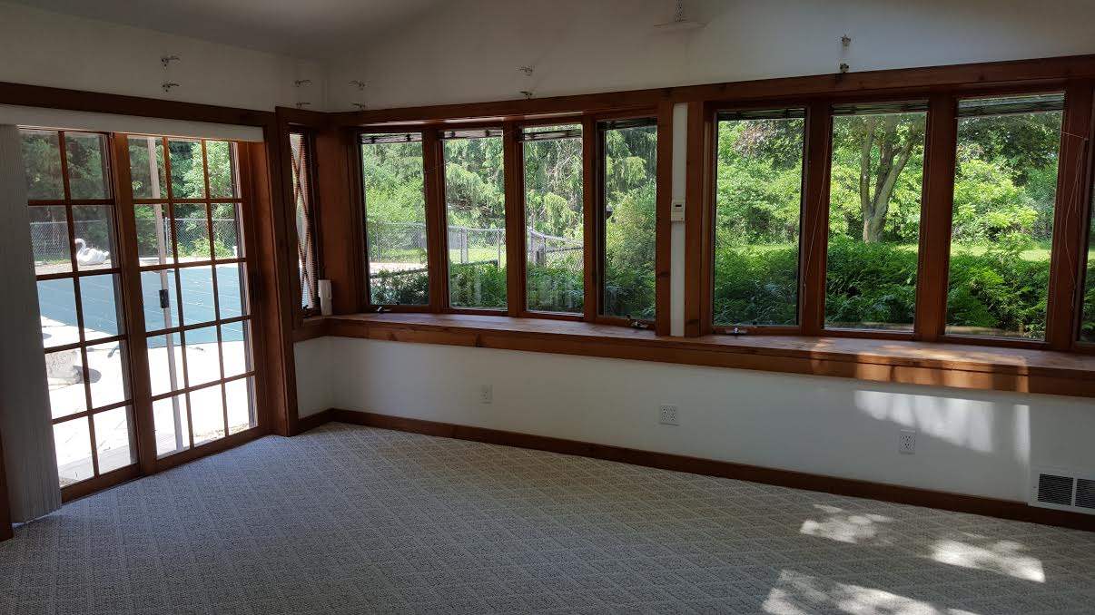 11154 Shaw Road Rockford, IL 61114 - Photo 15 of 25 wooden floor in an empty room with a window