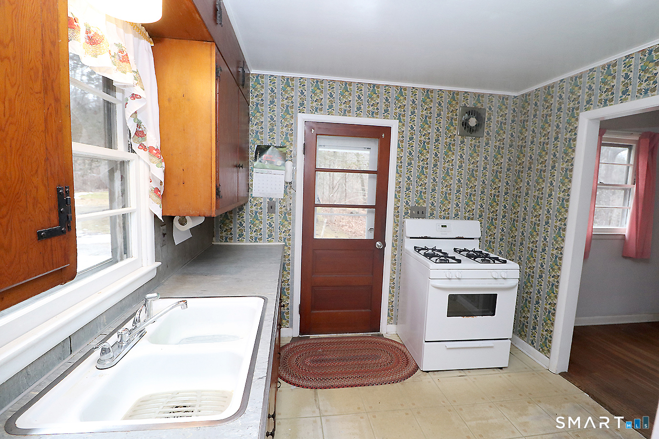 15 Connelly Road New Milford, CT 06776 - Photo 11 of 28 a kitchen with a stove a sink and a refrigerator