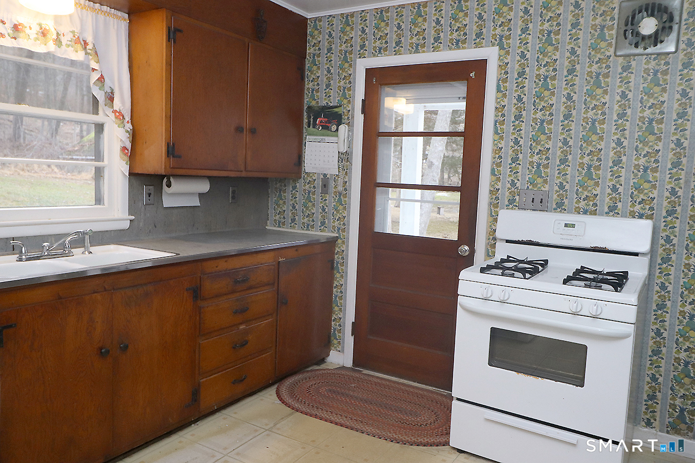 15 Connelly Road New Milford, CT 06776 - Photo 13 of 28 a kitchen with a stove and cabinets
