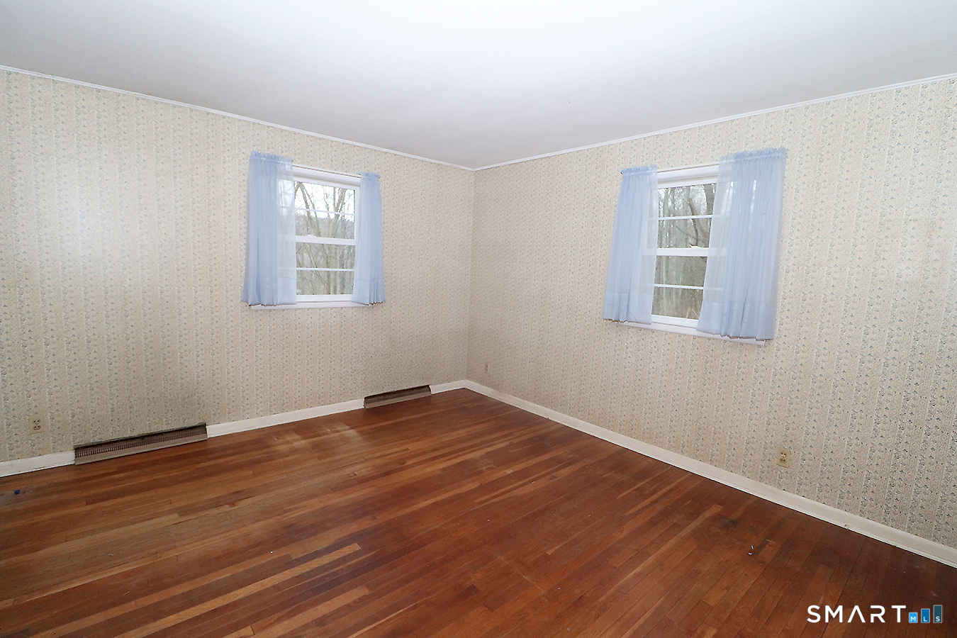 15 Connelly Road New Milford, CT 06776 - Photo 14 of 28 a view of an empty room with wooden floor and a window