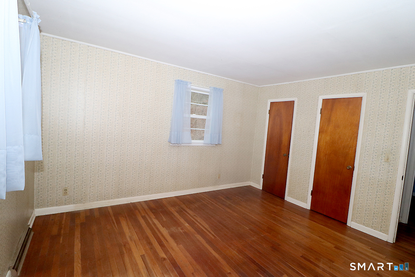 15 Connelly Road New Milford, CT 06776 - Photo 16 of 28 an empty room with wooden floor and closet