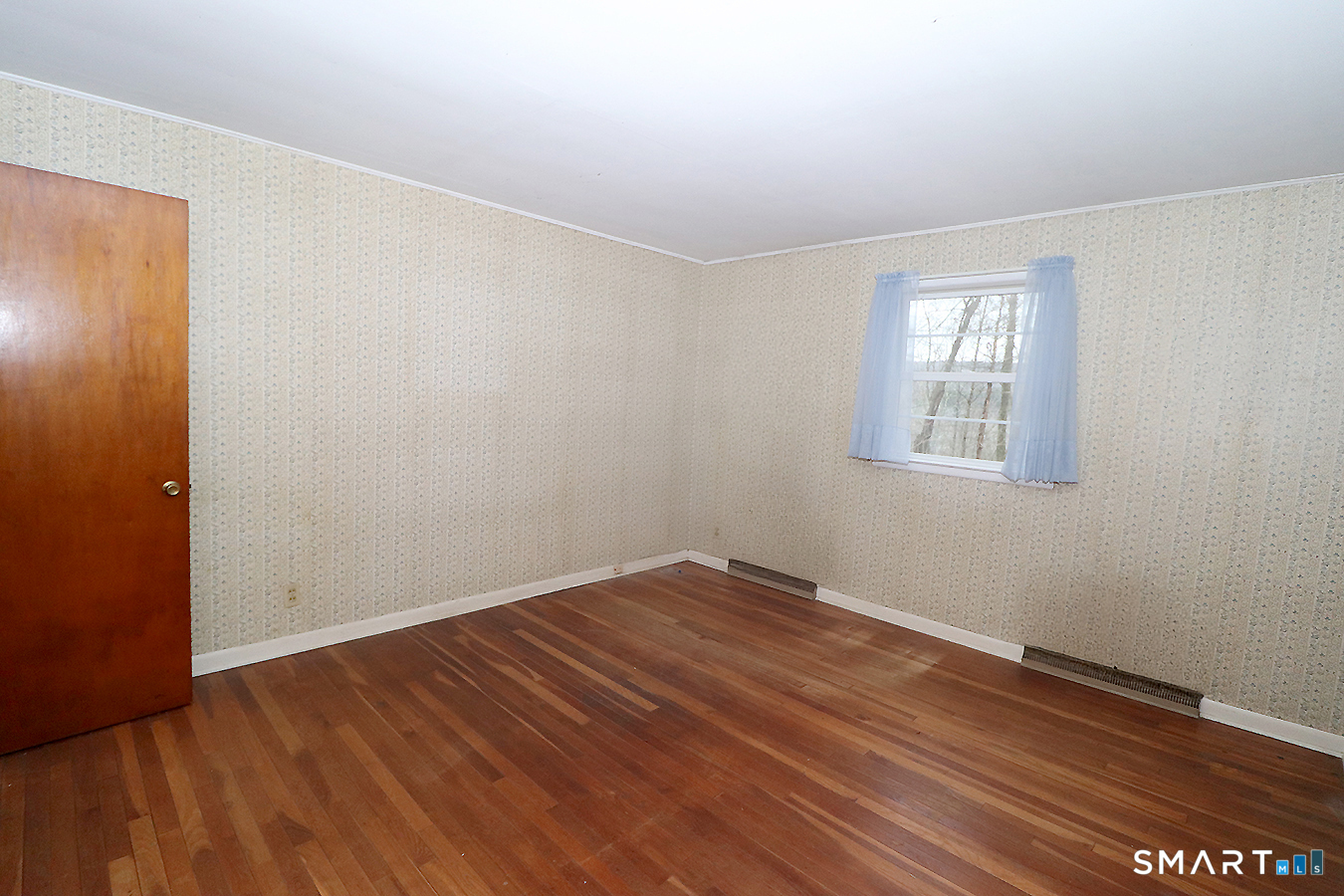 15 Connelly Road New Milford, CT 06776 - Photo 17 of 28 an empty room with wooden floor and windows