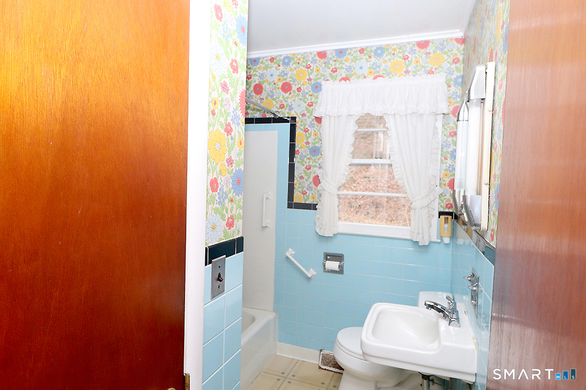 15 Connelly Road New Milford, CT 06776 - Photo 18 of 28 a bathroom with a sink and a mirror