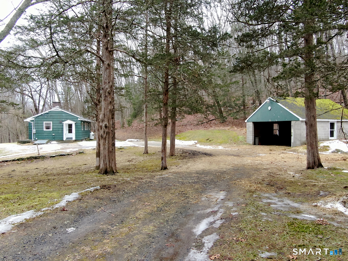 15 Connelly Road New Milford, CT 06776 - Photo 26 of 28 a front view of a house with a yard and tree s