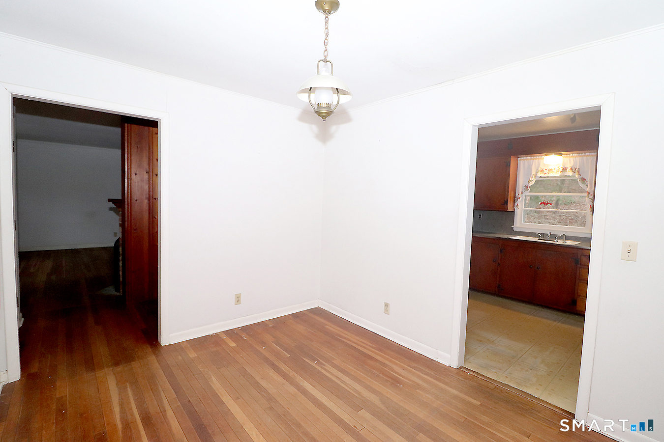 15 Connelly Road New Milford, CT 06776 - Photo 9 of 28 a view of a room with wooden floor and a ceiling fan