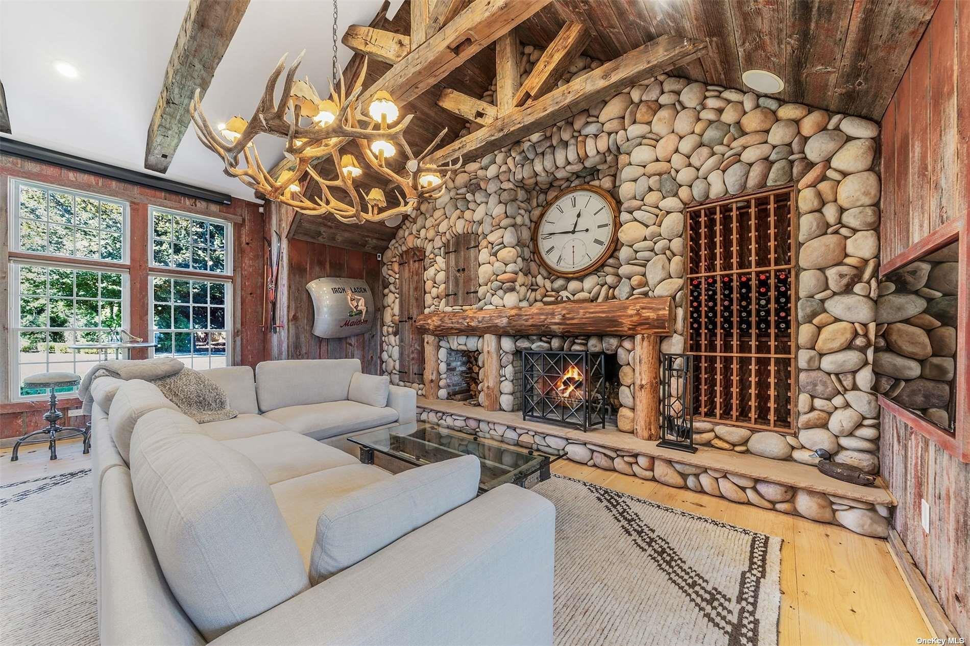 300 Maple Street Islip, NY 11751 - Photo 20 of 50 a living room with furniture a large window and a fireplace