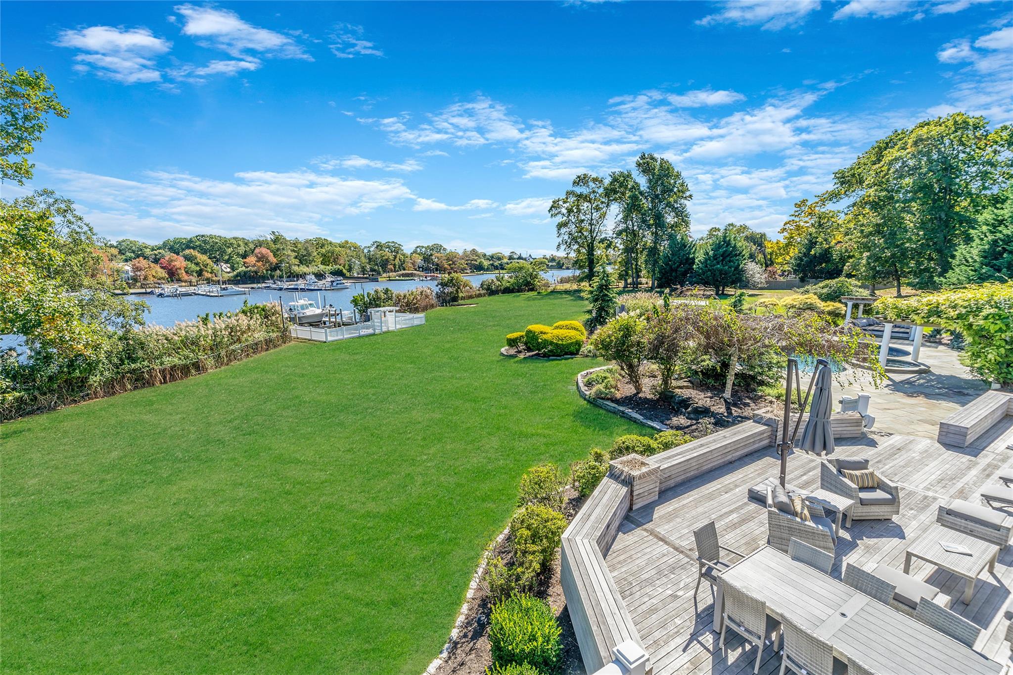 300 Maple Street Islip, NY 11751 - Photo 48 of 50 a view of a lake with a yard