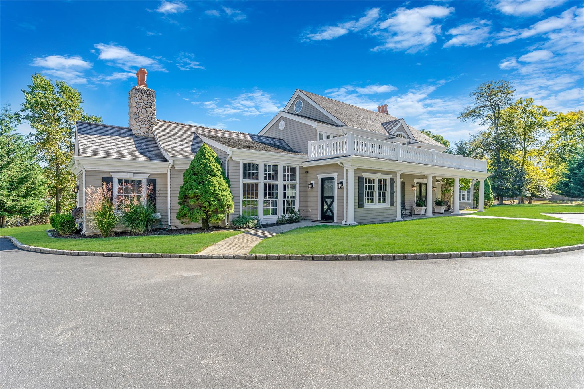 300 Maple Street Islip, NY 11751 - Photo 5 of 50 a view of a big house with a big yard and large trees