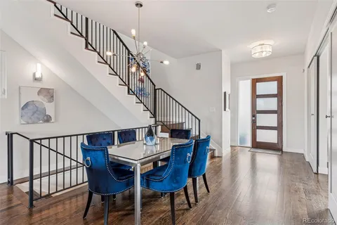 a view of dining room and hall with wooden floor