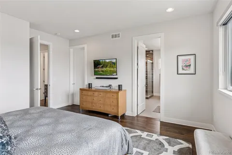 a bedroom with a bed and a couch