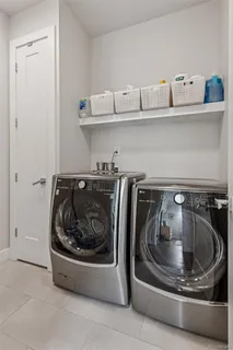 a utility room with washing machine