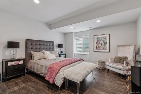 a bedroom with a bed and a couch