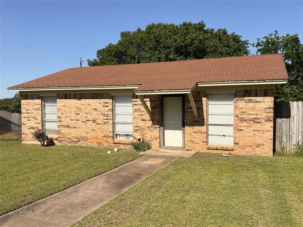 1829 South Center Street Denison, TX 75021 - Photo 2 of 29 a view of a house with backyard and garden