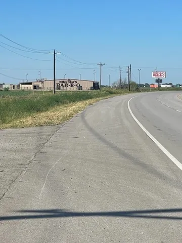a view of a lake with houses in the back