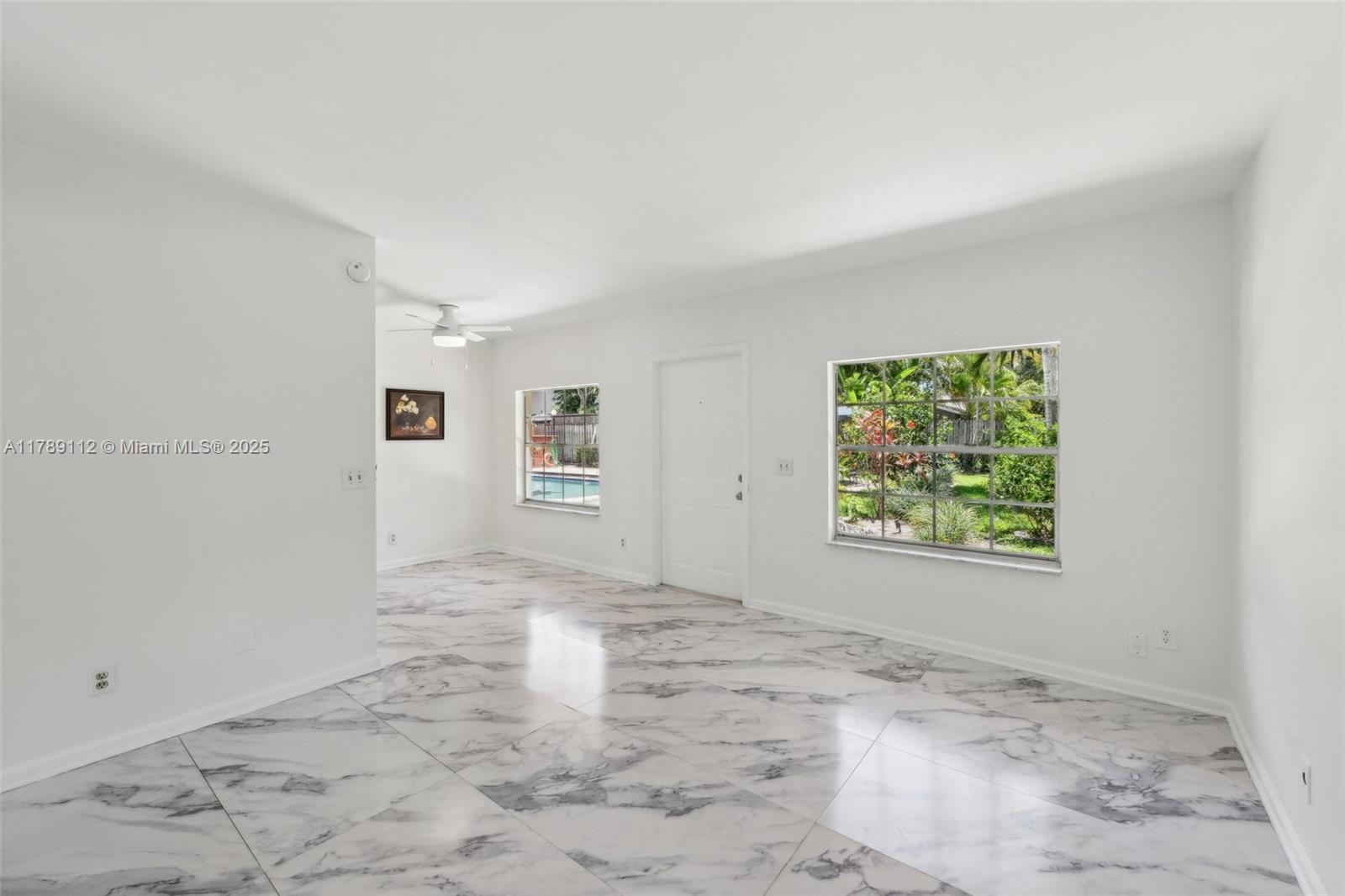 1405 Miami Road, Unit 5 Fort Lauderdale, FL 33316 - Photo 11 of 38 an empty room with windows