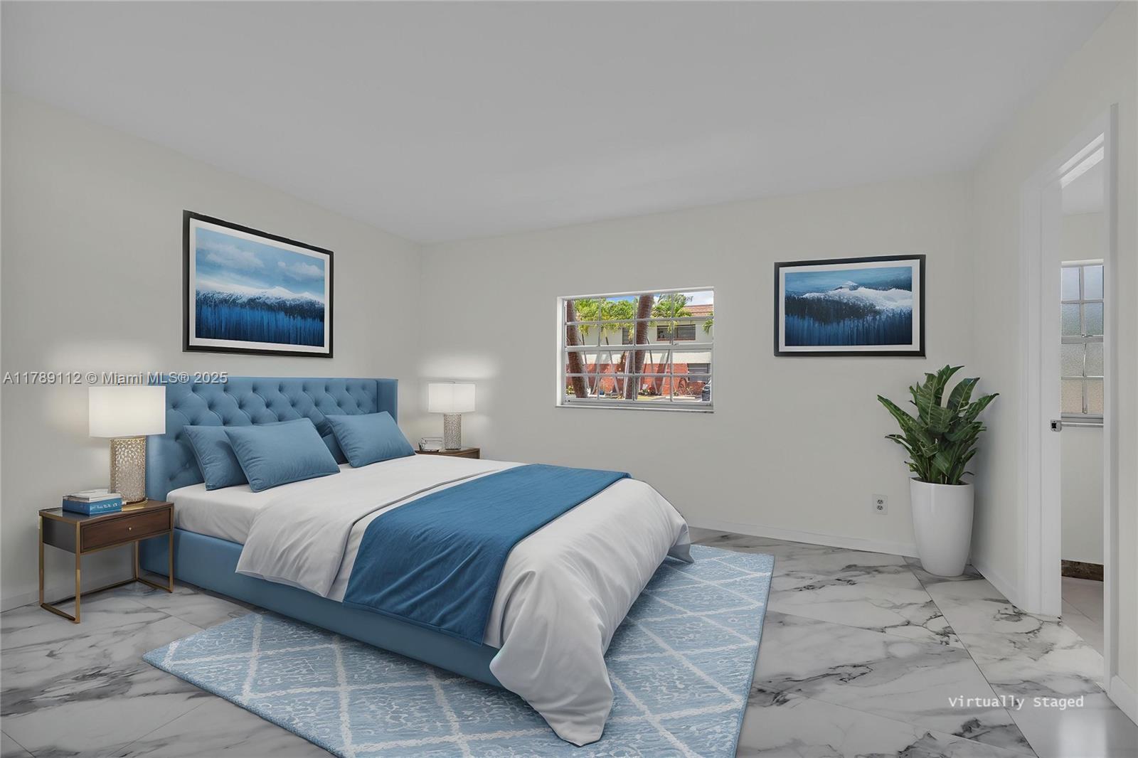 1405 Miami Road, Unit 5 Fort Lauderdale, FL 33316 - Photo 12 of 38 a bedroom with a large bed and a window