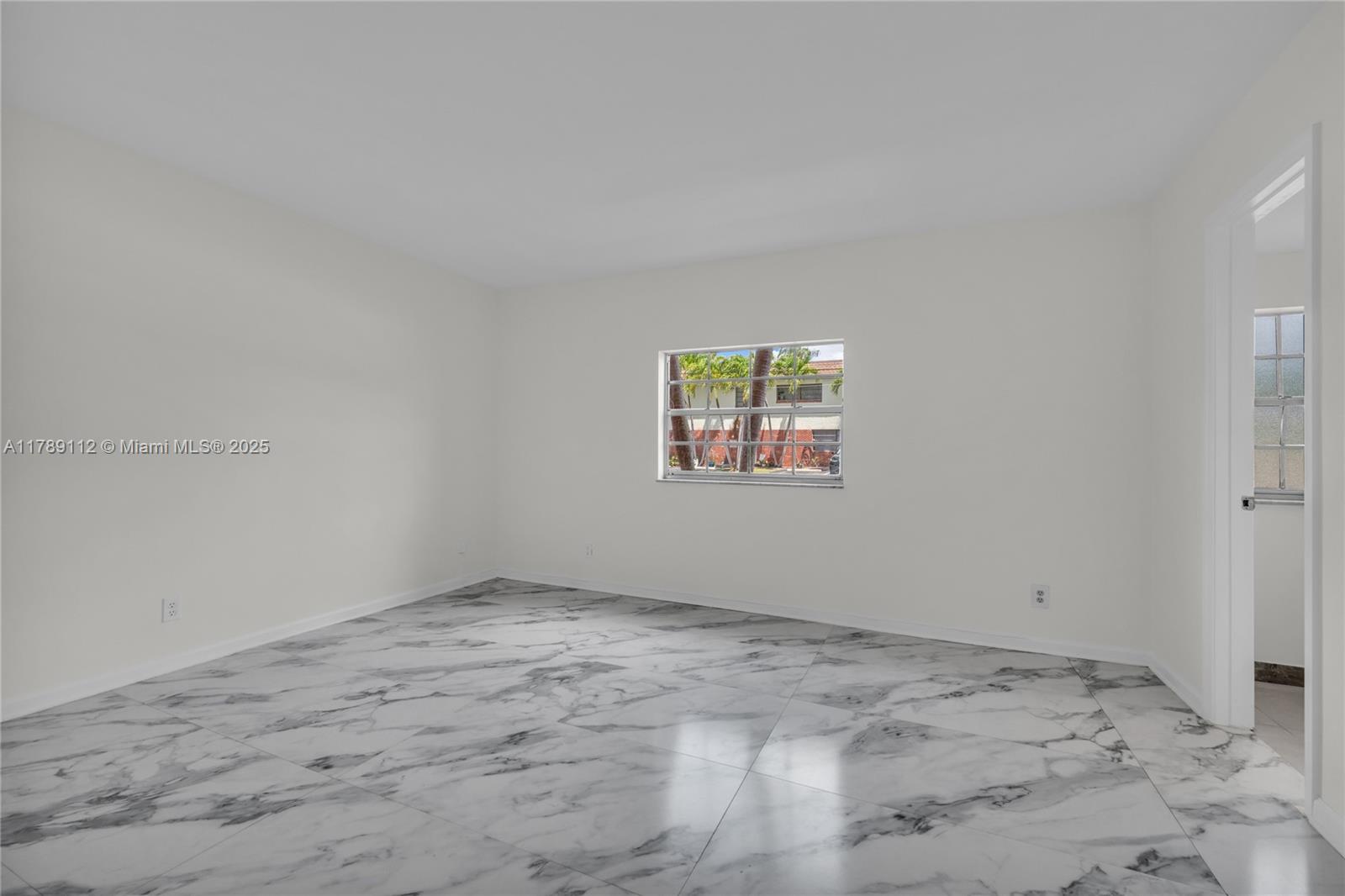 1405 Miami Road, Unit 5 Fort Lauderdale, FL 33316 - Photo 13 of 38 an empty room with a workbench
