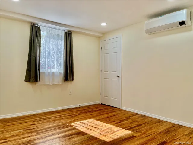 a view of a livingroom with wooden floor and closet