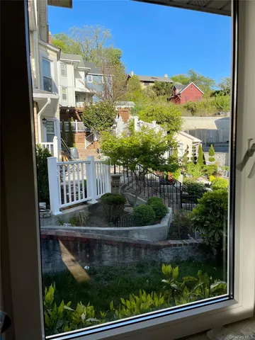 a view of a balcony with plants