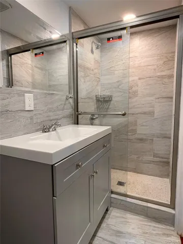 a bathroom with a sink and mirror