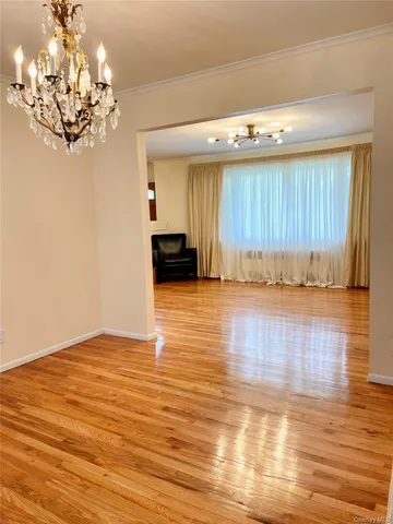 a view of a livingroom with wooden floor
